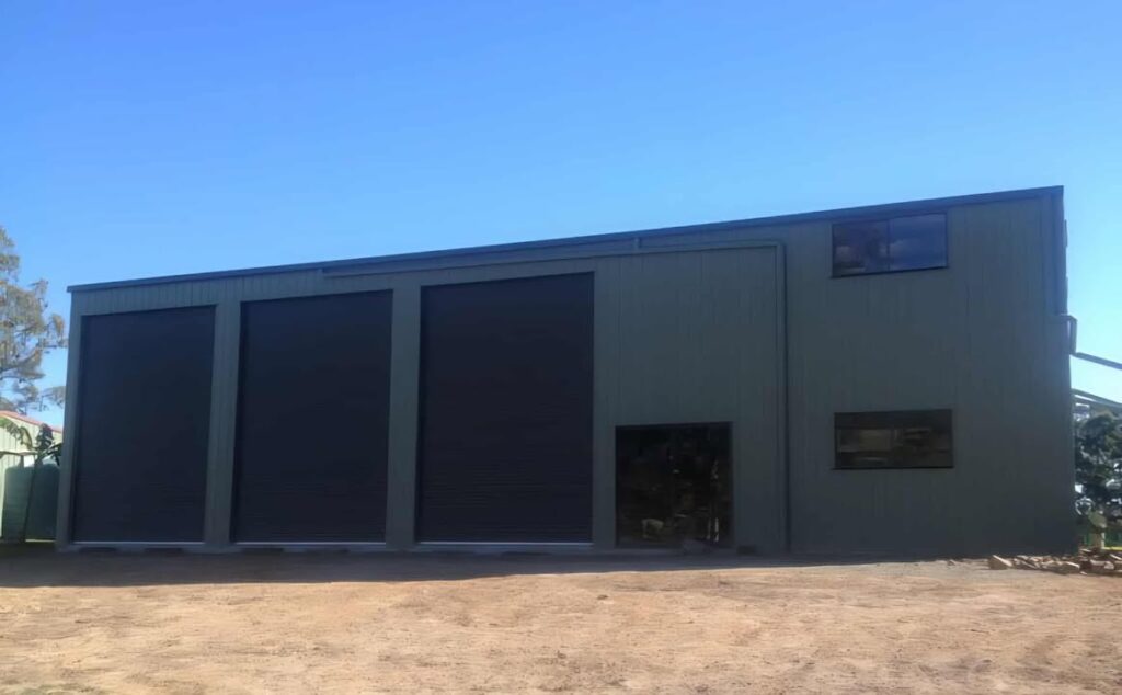 Heavy-duty industrial sheds made with BlueScope steel. Large span buildings, high walls, rugged construction. Custom quotes for Aussie sites.